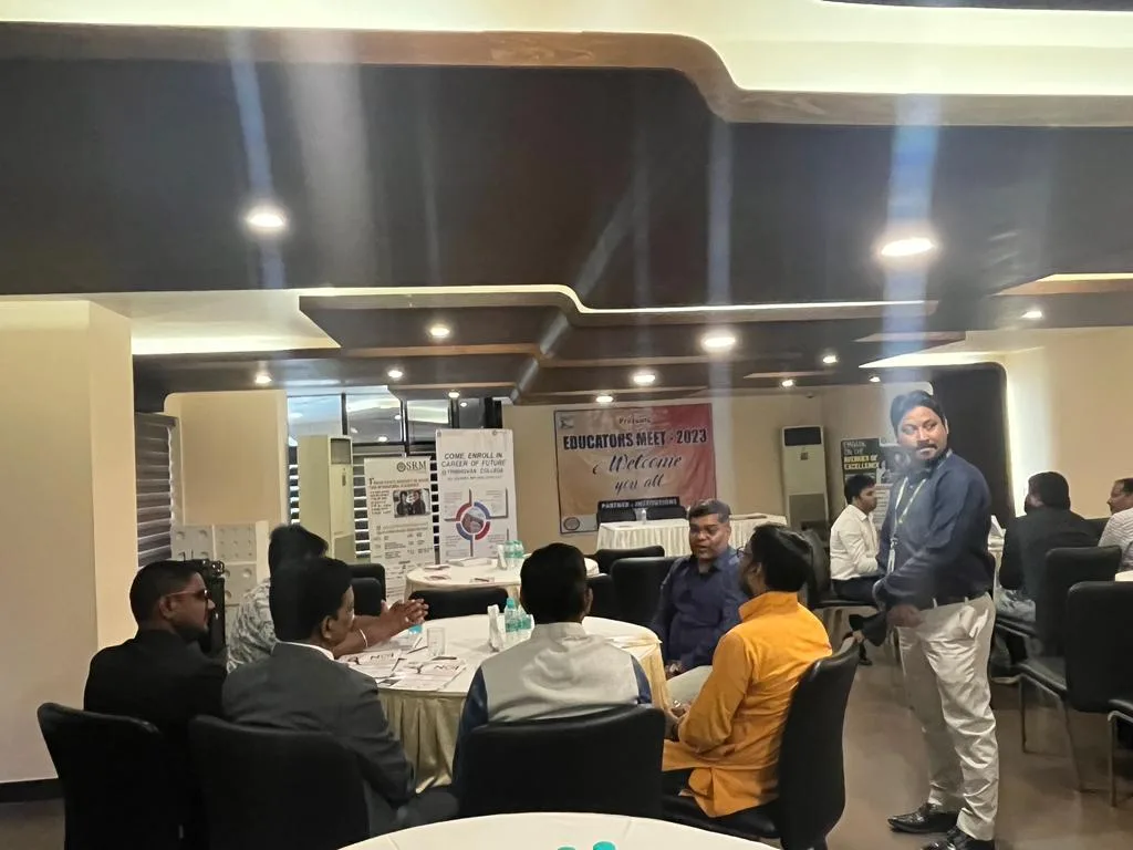 Participants seated around a table at Educators Meet 2023